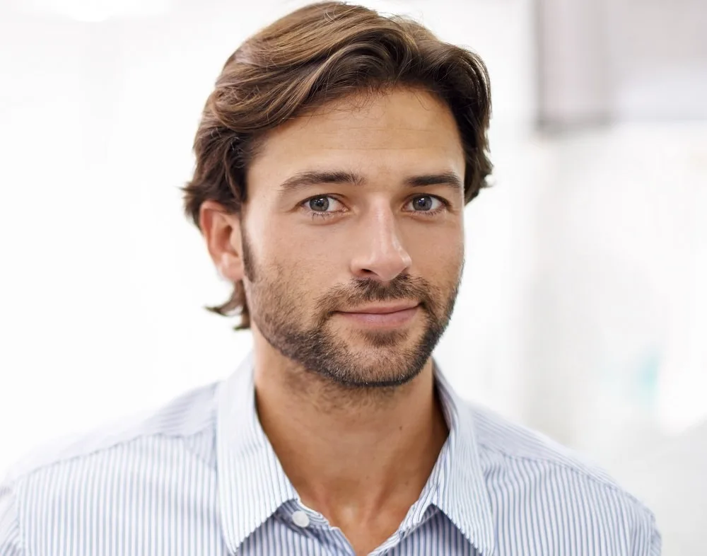 square faced man with feather hairstyle