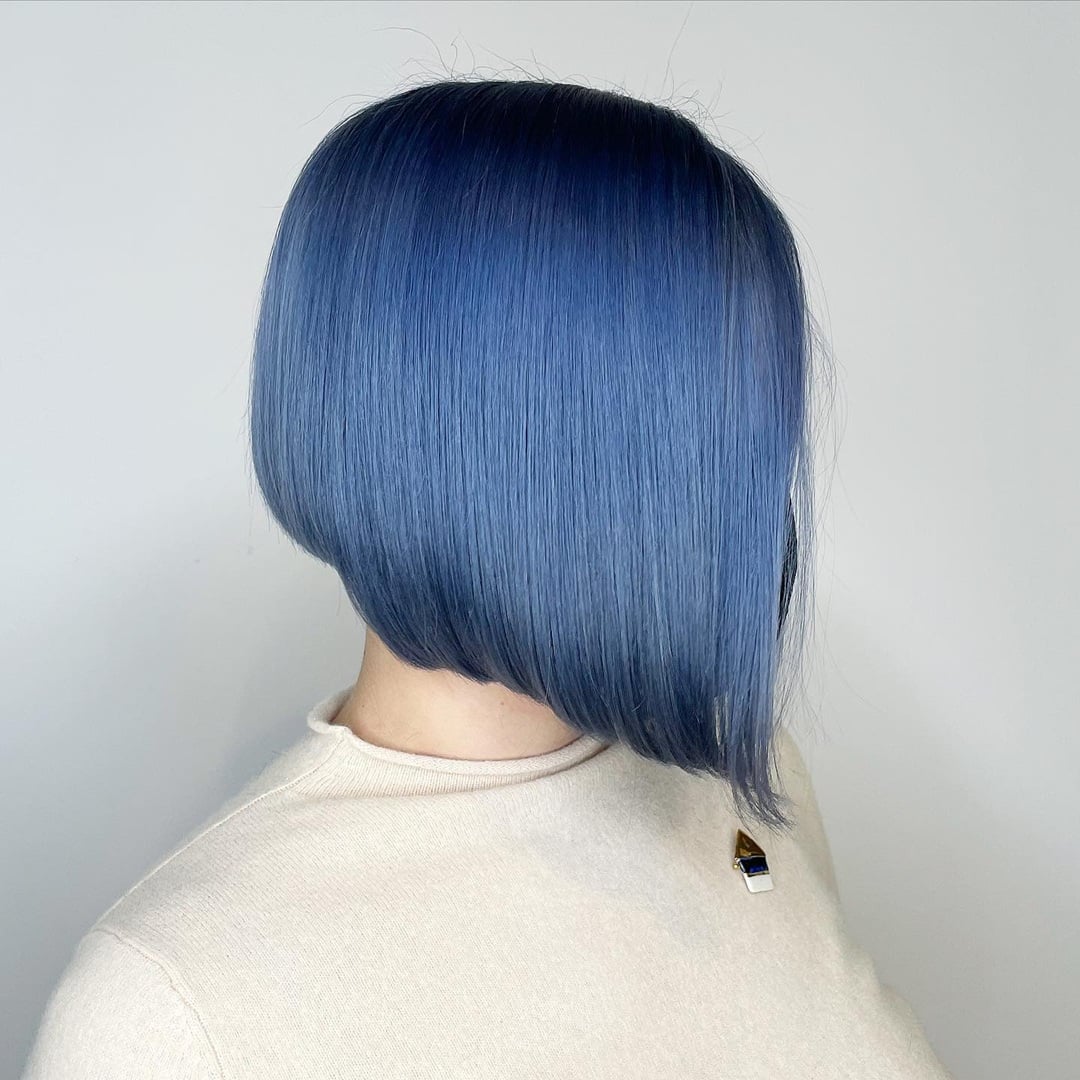 Sleek denim blue straight bob hairstyle with an angled A-line cut