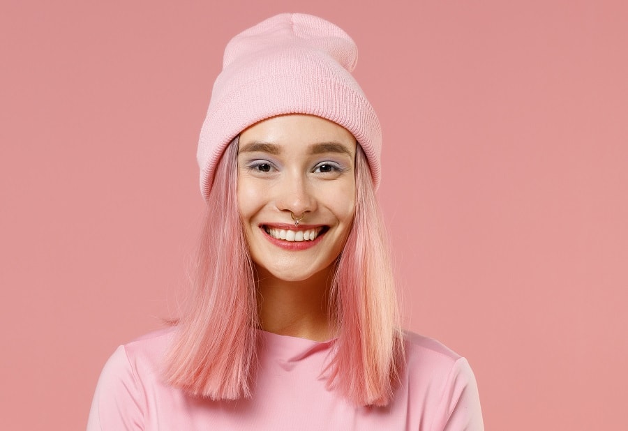 Straight pink hair with a beanie hat