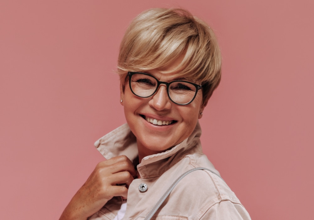 Straight pixie cut for older women with glasses