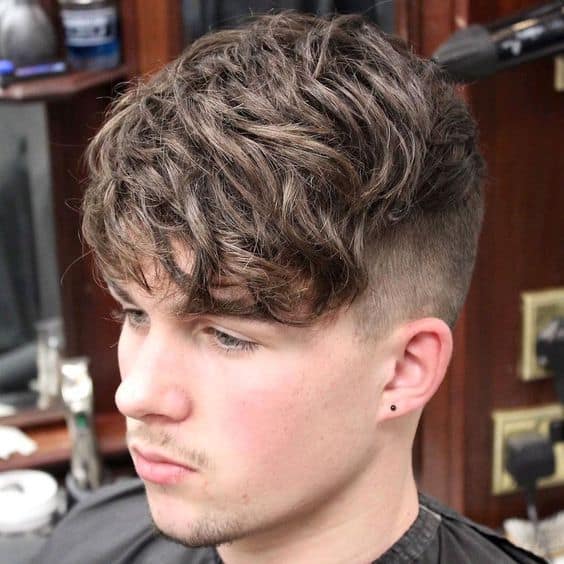 side swept tapered fade curly hairstyle