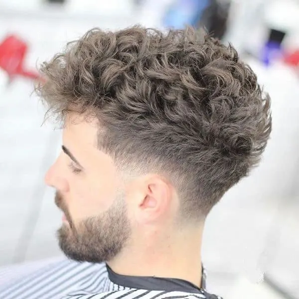 tapered fade haircut with curly hair