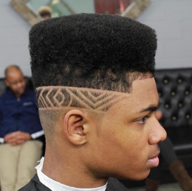 Taper Fade with Side Part and Design