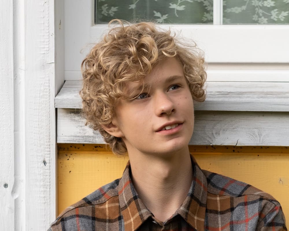 teen boy with blonde curls