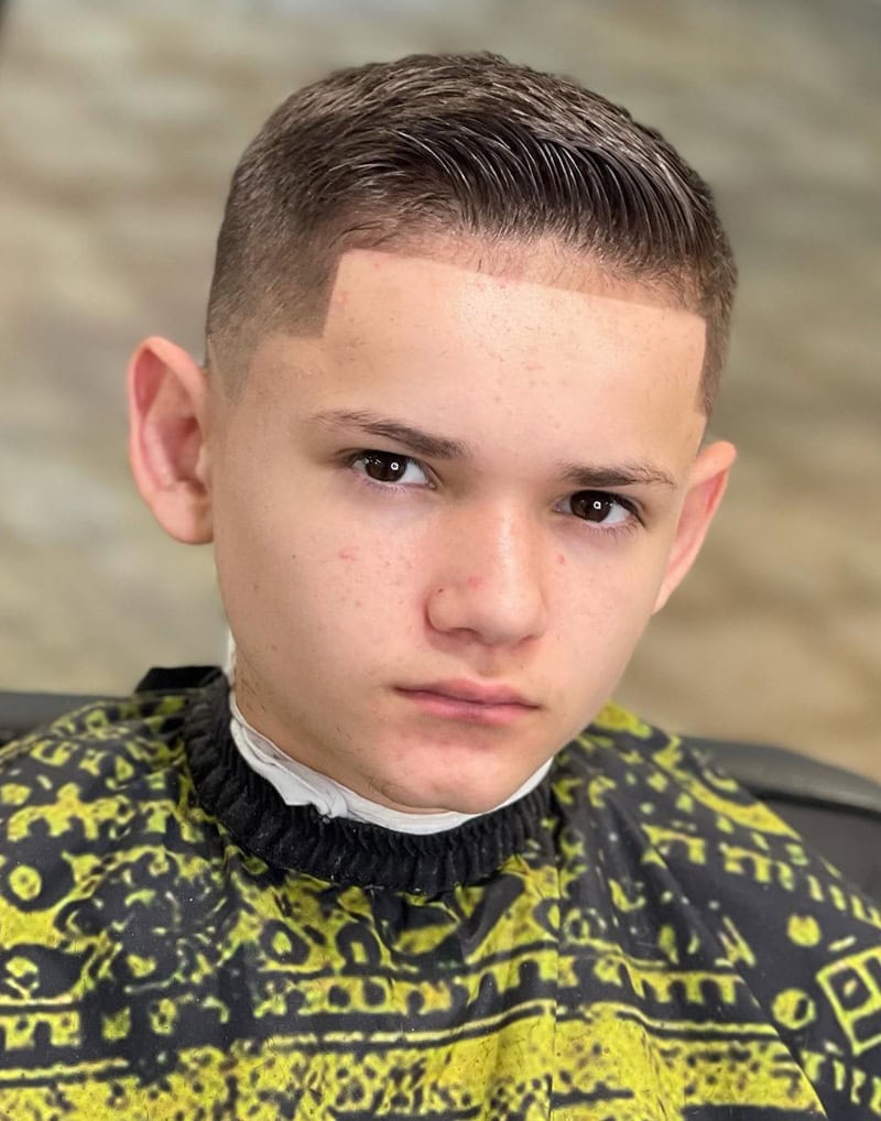 Neat slick back side part comb over