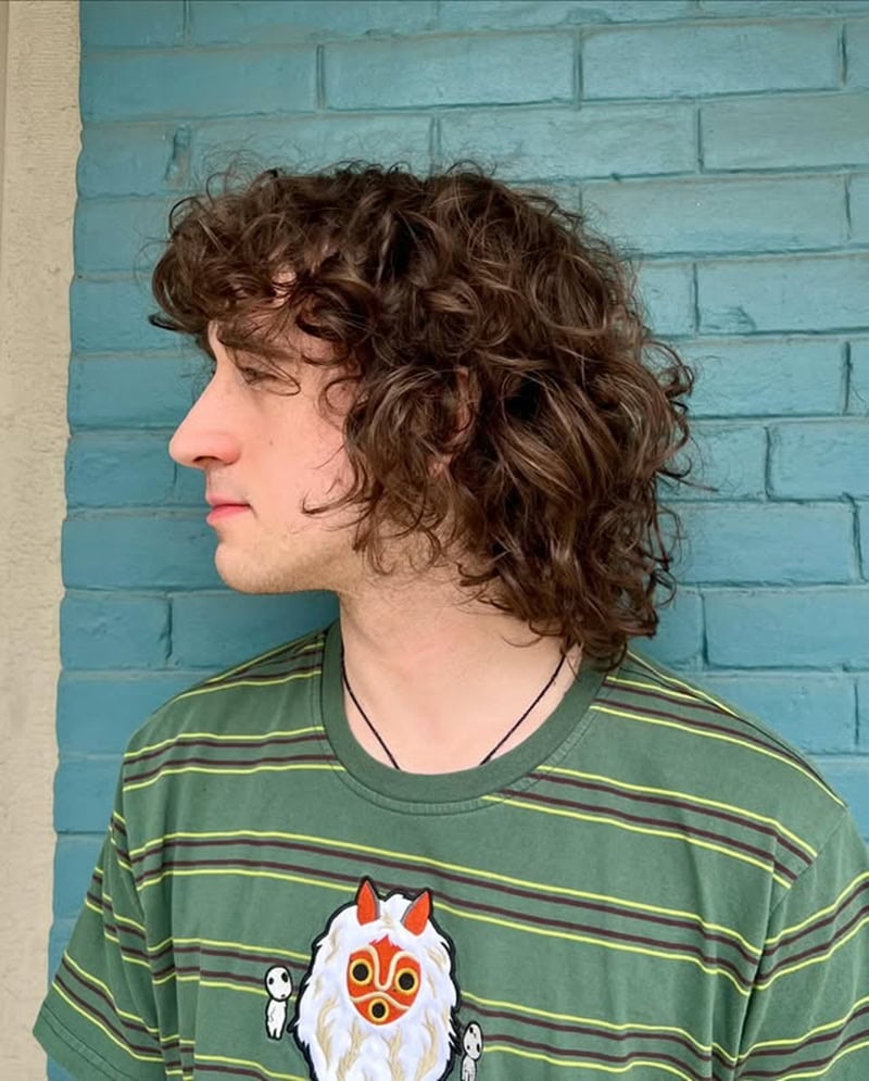 thick long brown ringlets and messy shaggy bangs