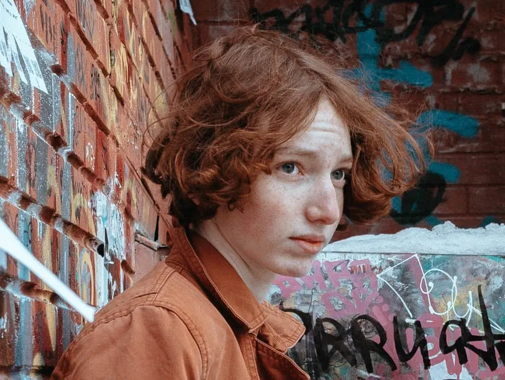 teenager boy with wavy red hair