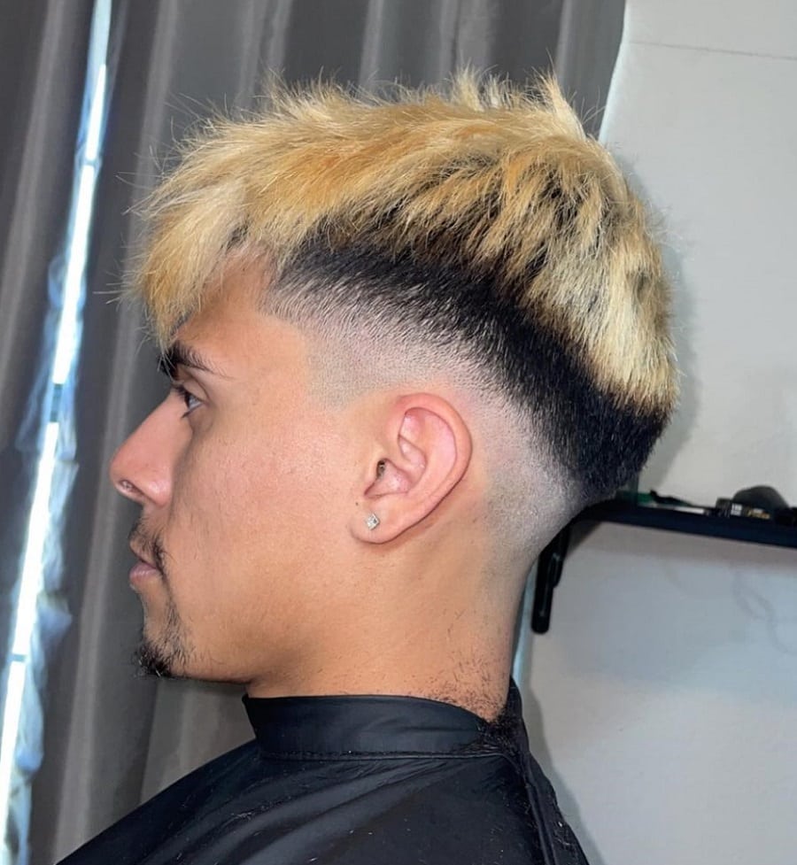 textured hair with mid taper fade