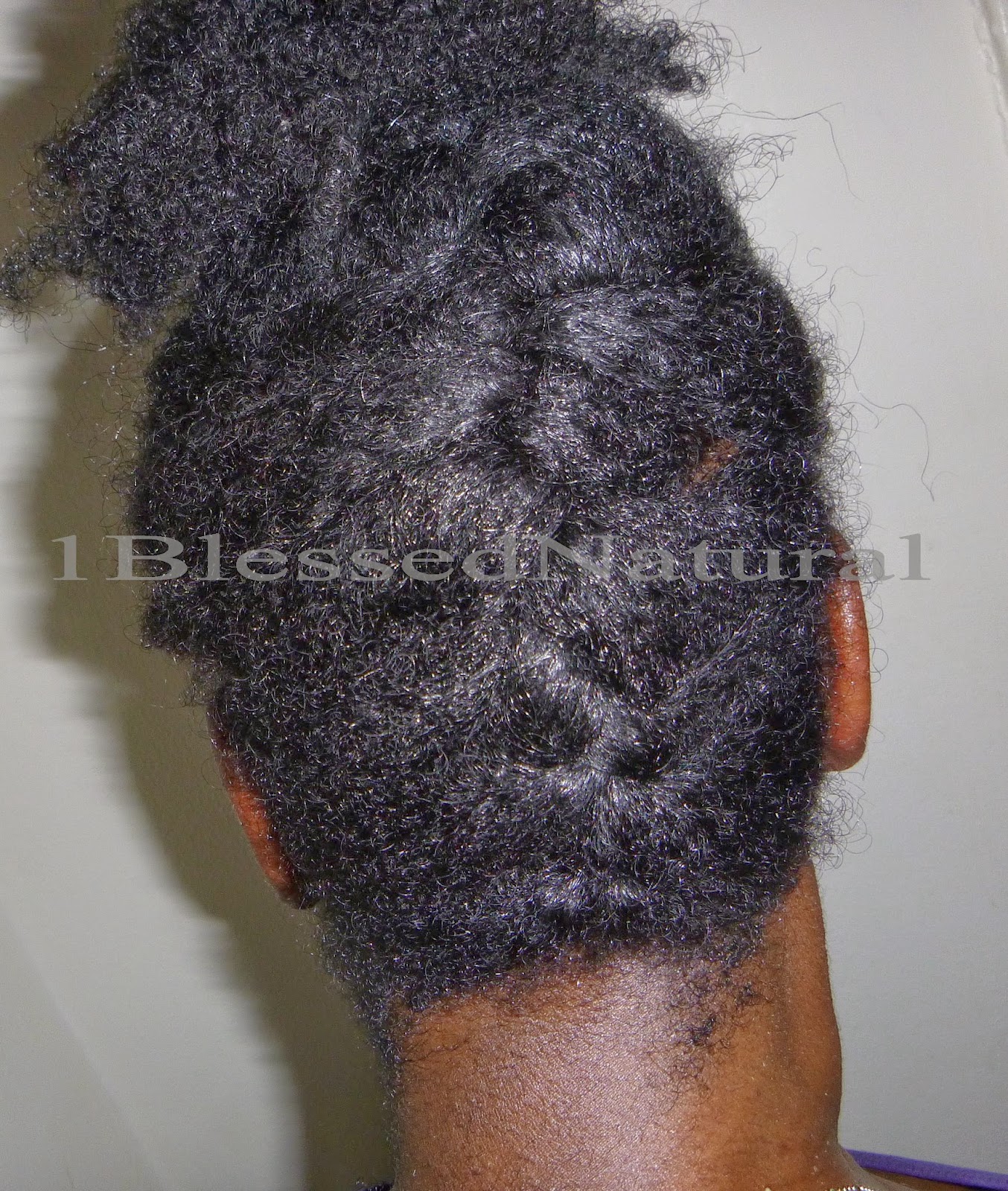 Textured French braid running upward from the nape with loose volume above it.