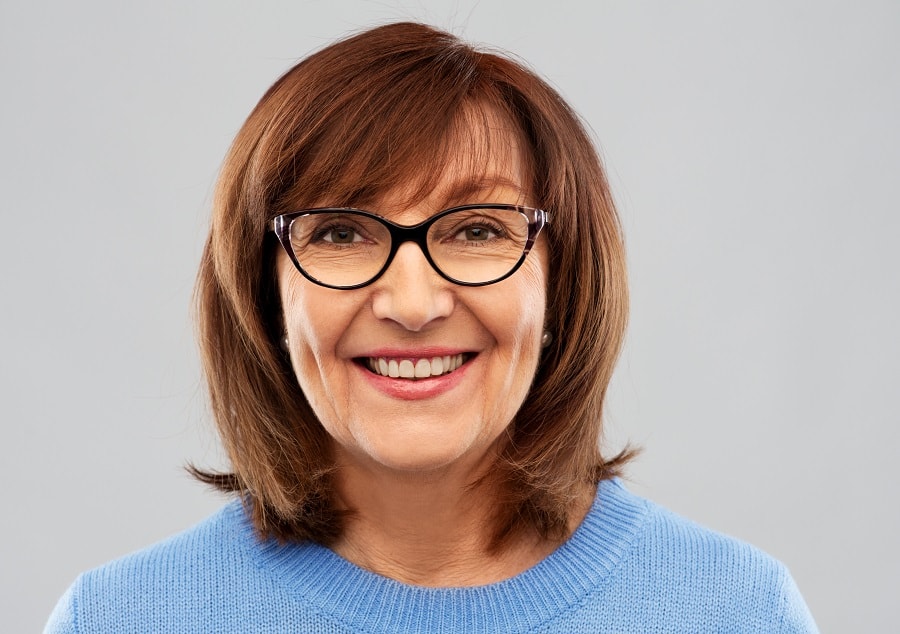 thick hairstyle for women over 60 with glasses