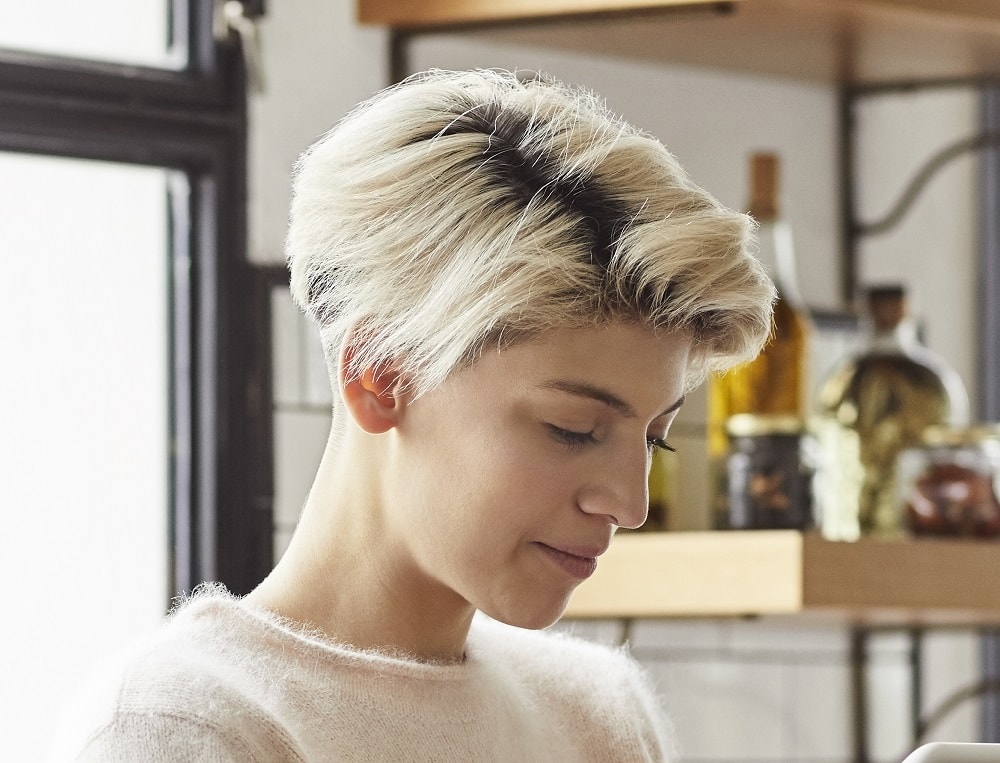 thick pixie cut with dark roots
