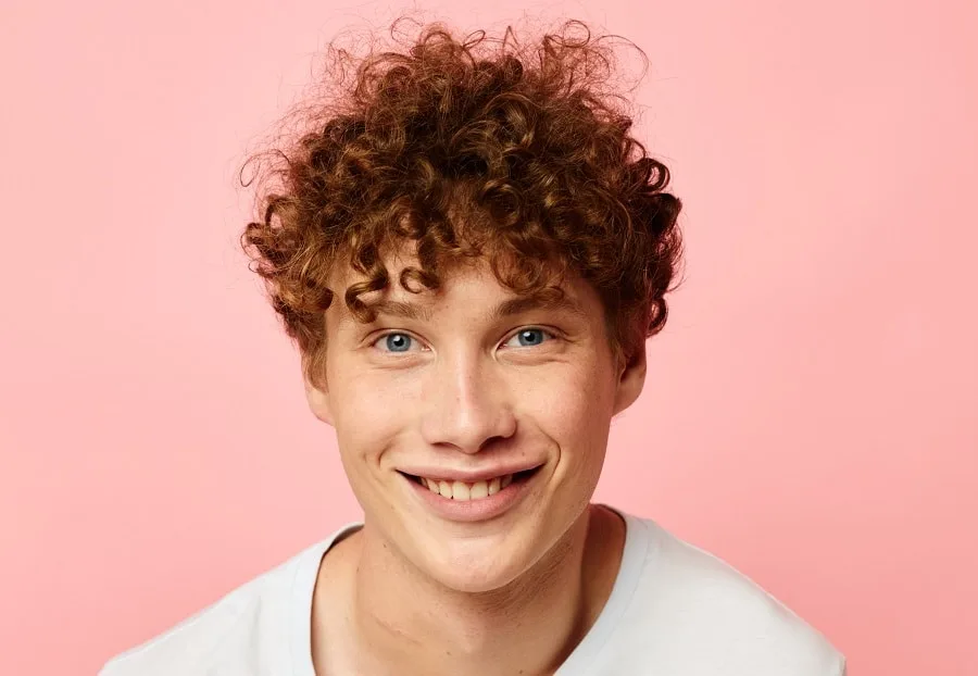 thick tight perm hairstyle for men