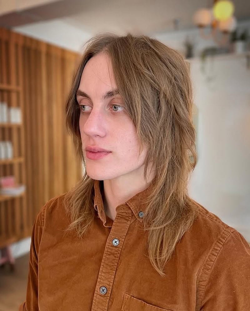 long and layered brown hairstyle for boys