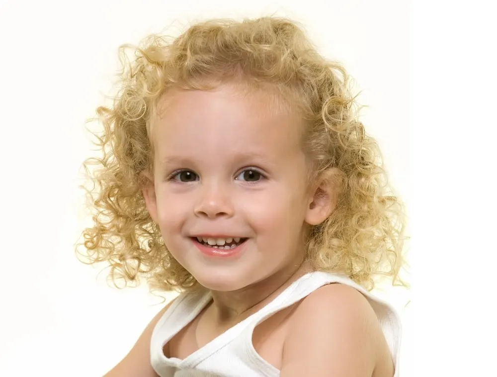 toddler boy with long blonde curls