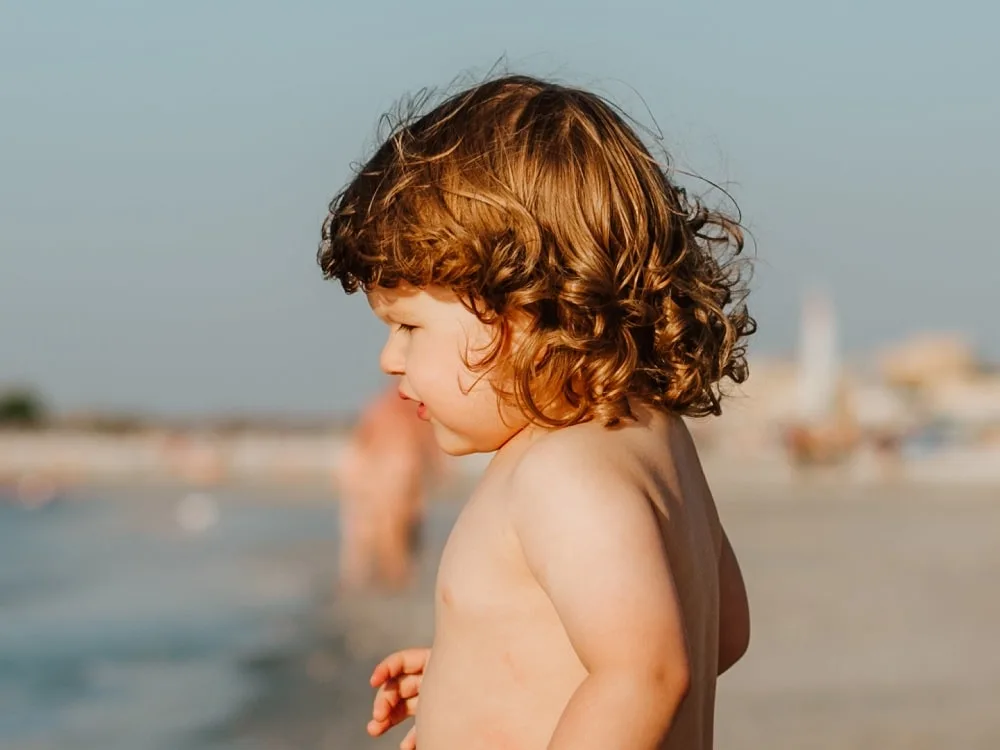 toddler boy's long ginger hair