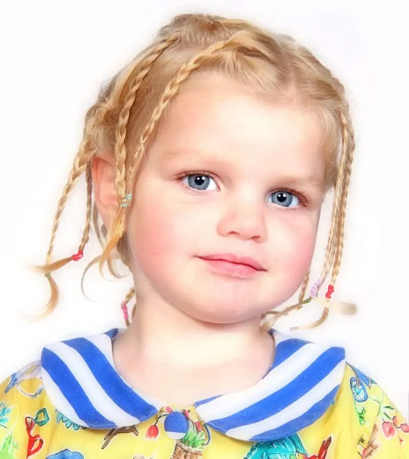 toddler girl with multiple braids