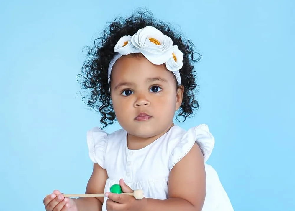 toddler girl's headband hairstyle