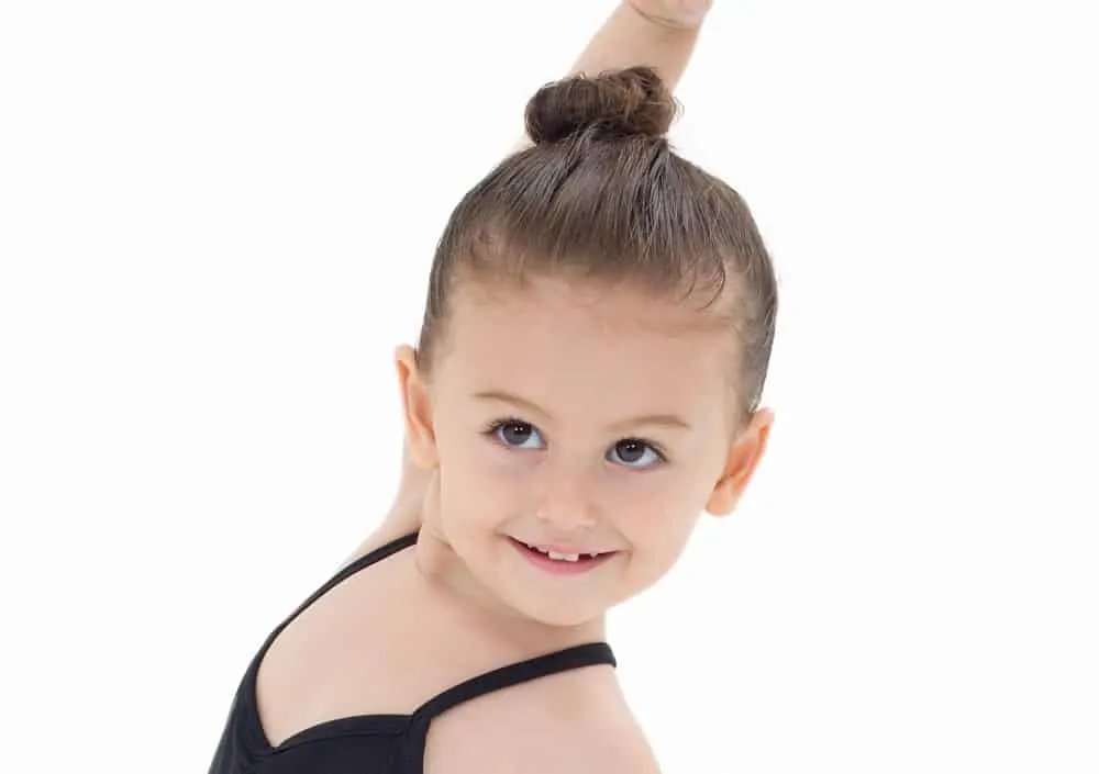 toddler girl's sleek bun style