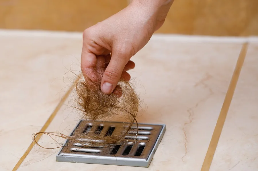 too much hair on shower floor