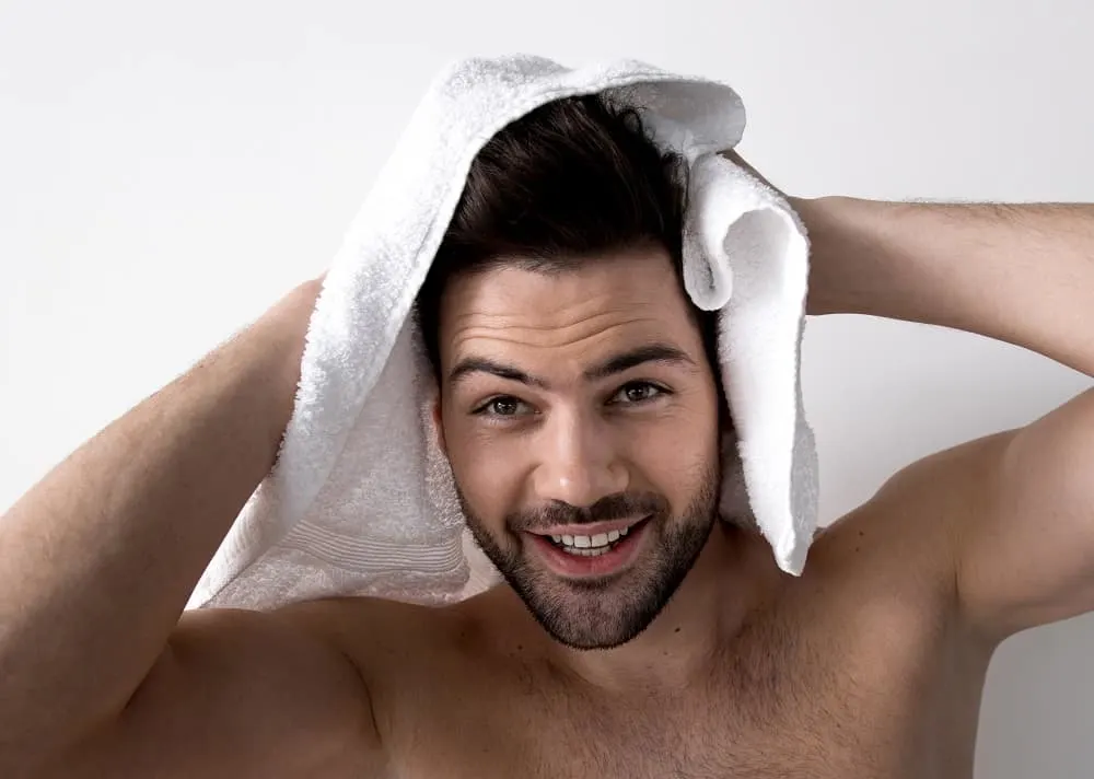 towel drying men's hair