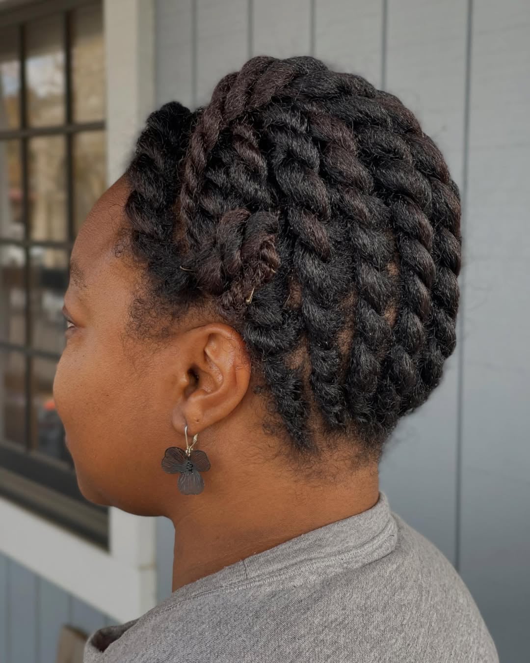 flat twist protective updo braided hairstyle for black girls