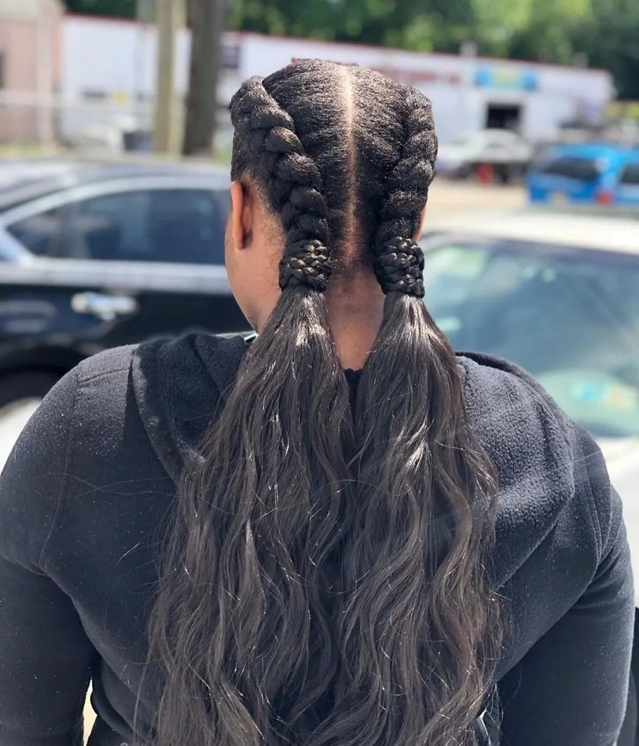 two cornrows with wavy ends
