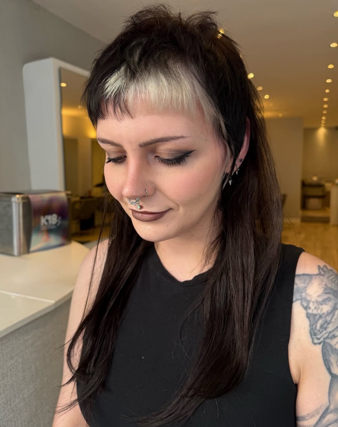 Two tone long shag rockabilly hairstyle with bleached platinum micro bangs