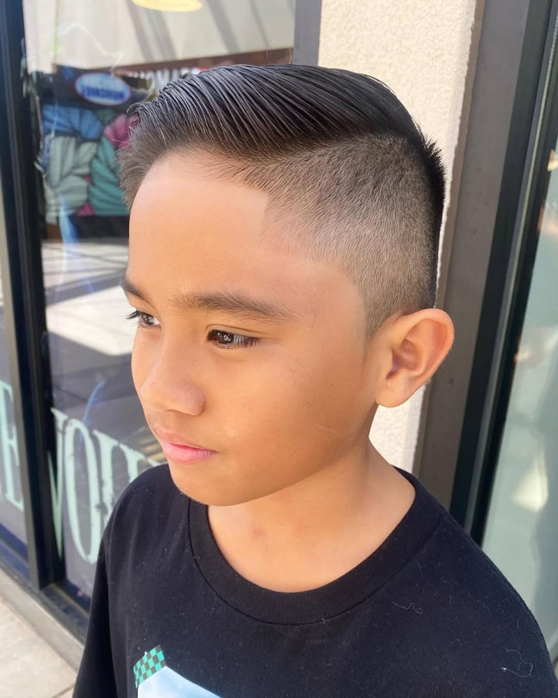 sharp undercut hard part comb over for boys.