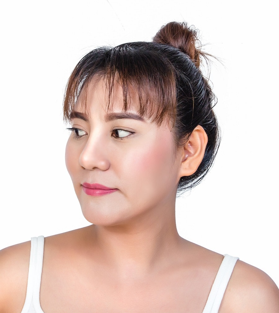 updo with bangs for round faces