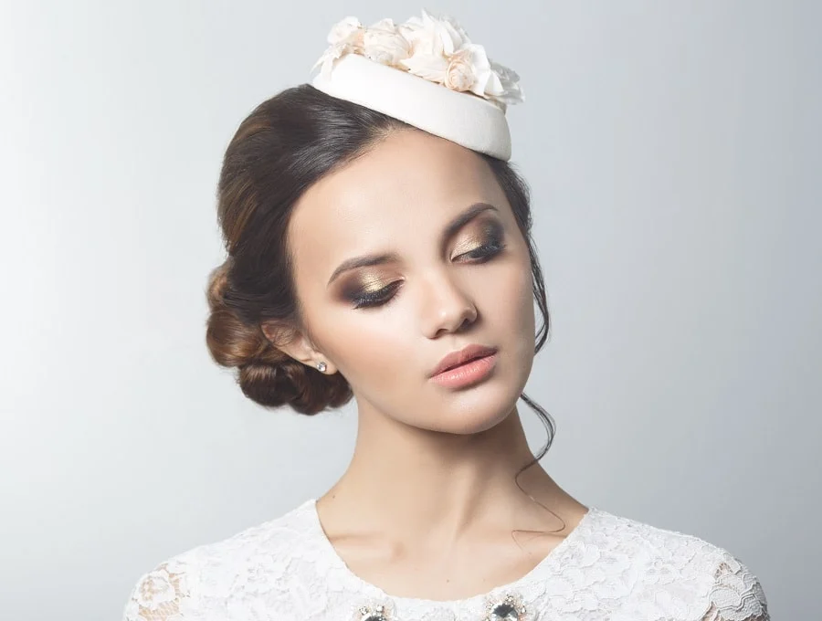 updo with wedding hat