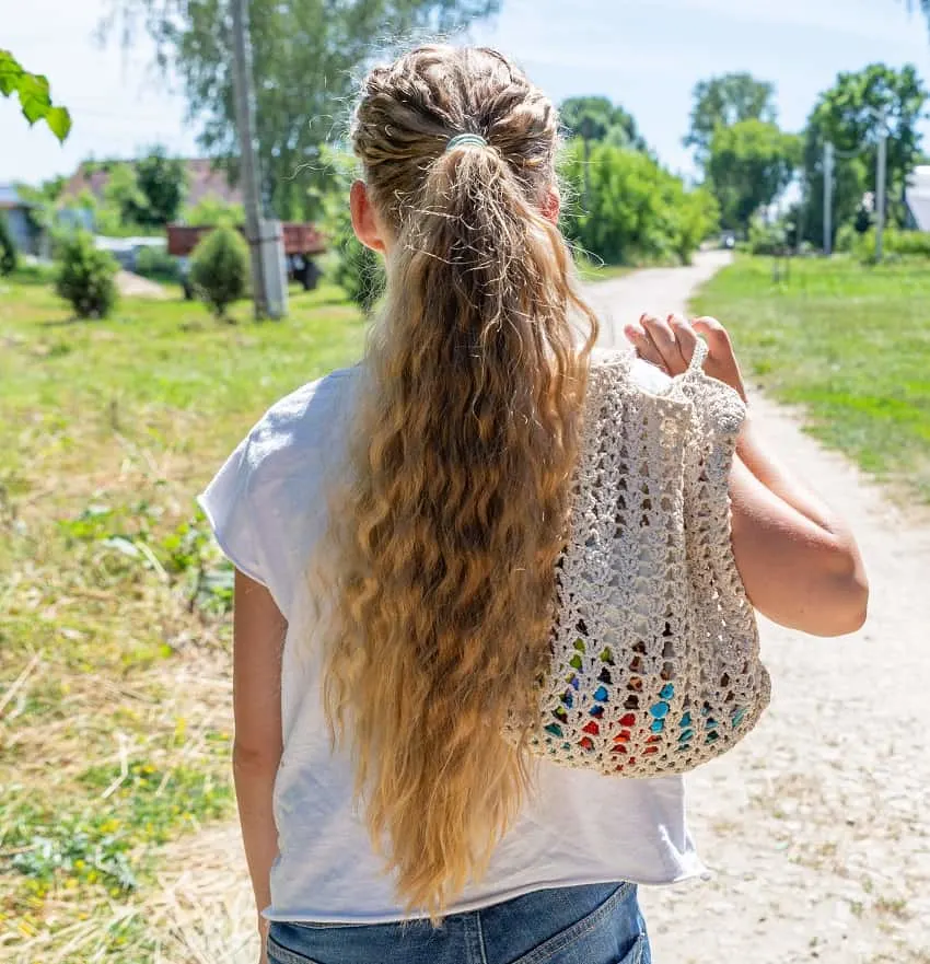 very long curly ponytail