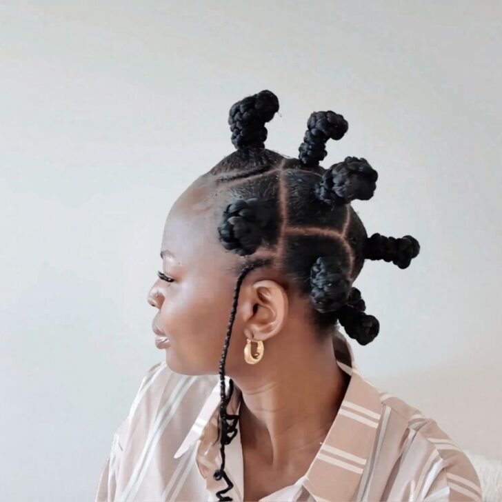 Recreated viral Bantu knot hairstyle with clean curved partings, raised knots, and a coiled side braid.