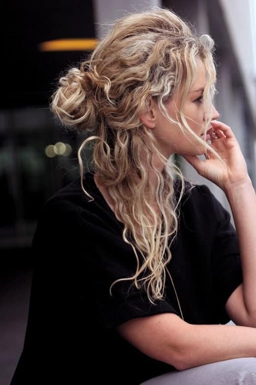 wavy blonde hair with low bun