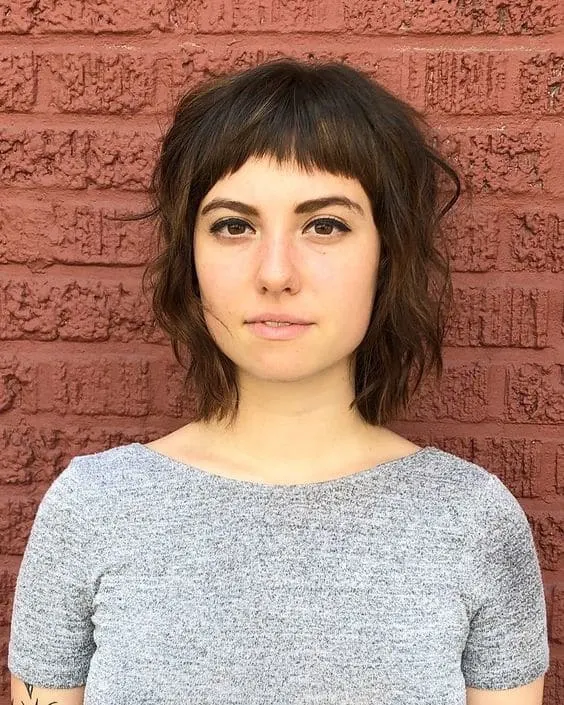 wavy bob with baby bangs