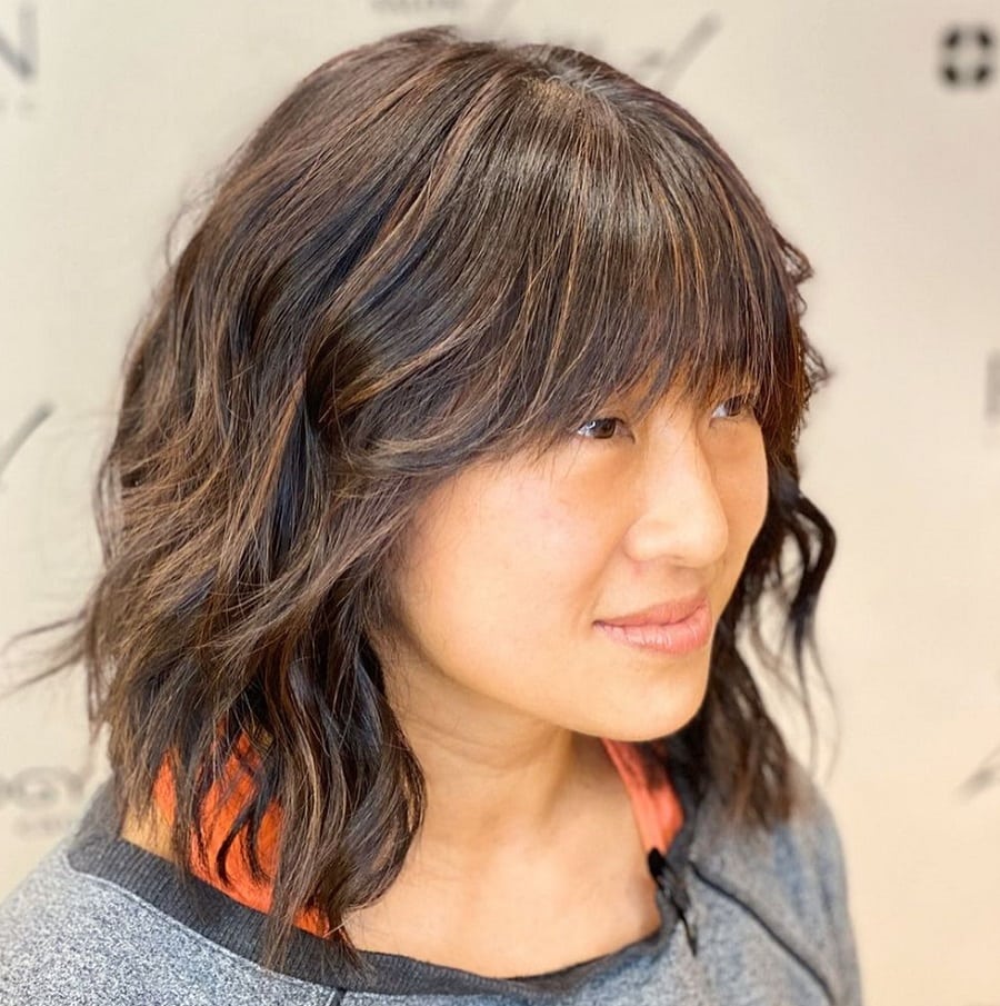wavy bob with feathered blunt bangs