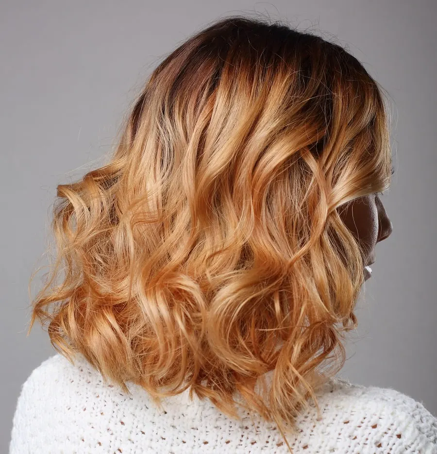 wavy copper blonde balayage hair