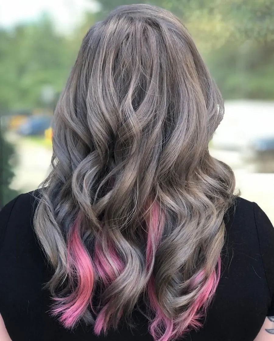 wavy gray hair with pastel pink highlights