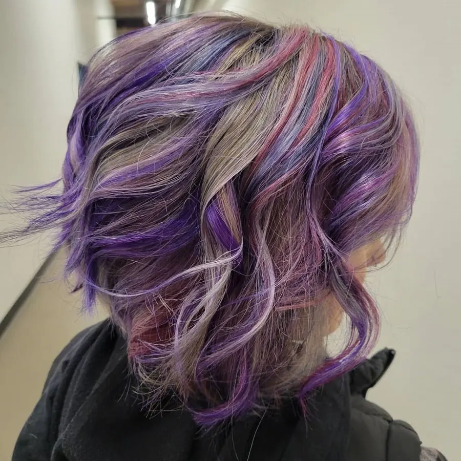 wavy gray hair with pink and purple highlights