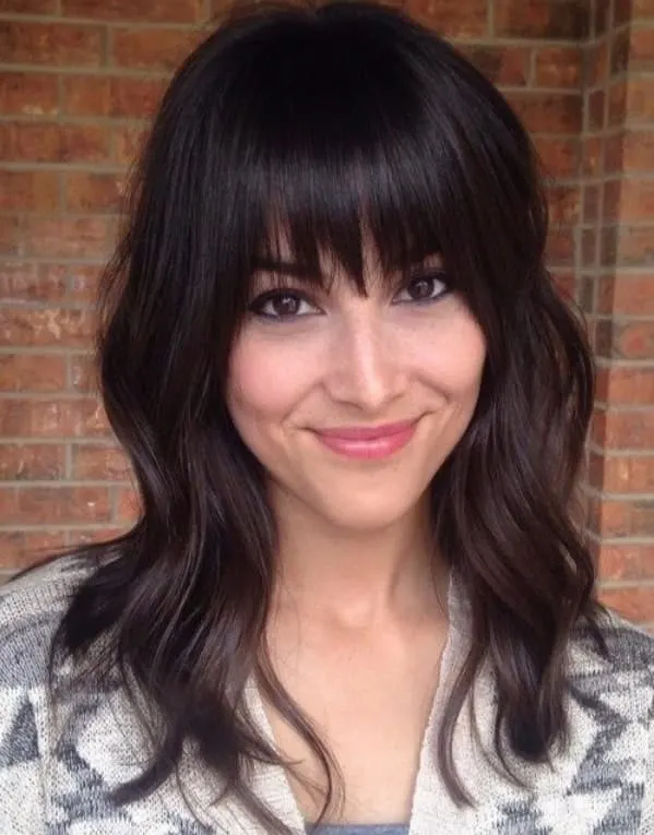 Girl with Shaggy Wavy Hair and Long Bangs