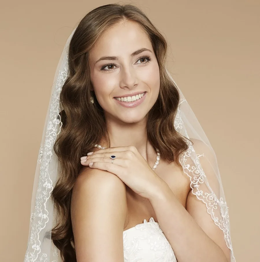 wavy hairstyle with veil for brides