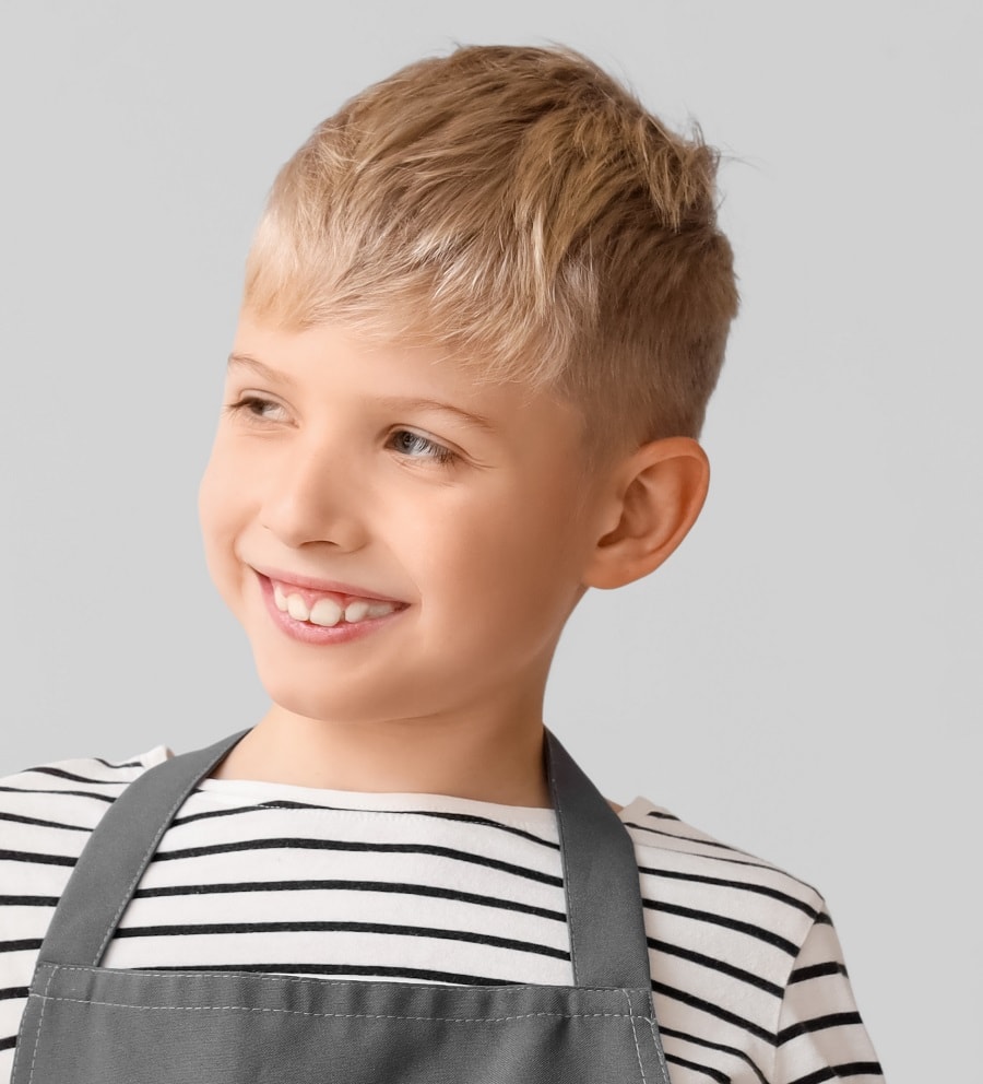 wavy long top with short side haircut for blonde boy