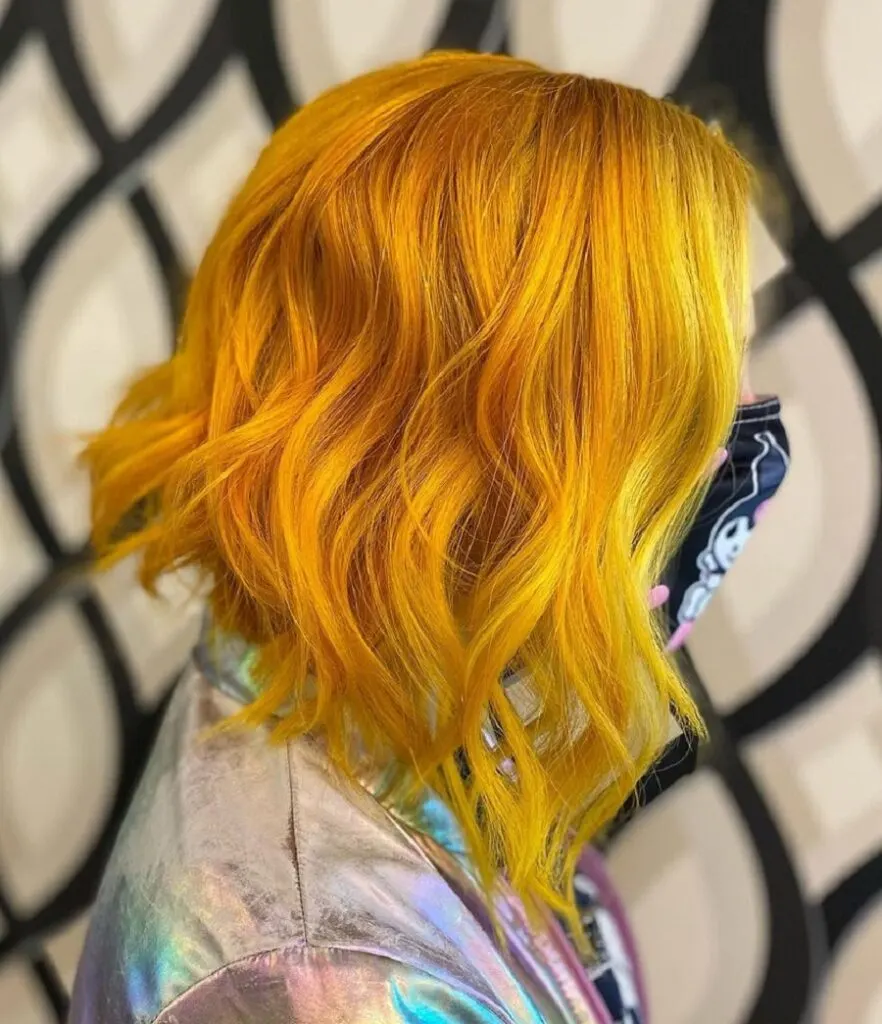 wavy short in back and long in front yellow hair