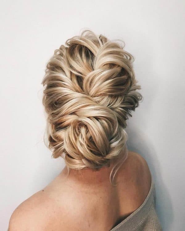 low bun with weave for wedding
