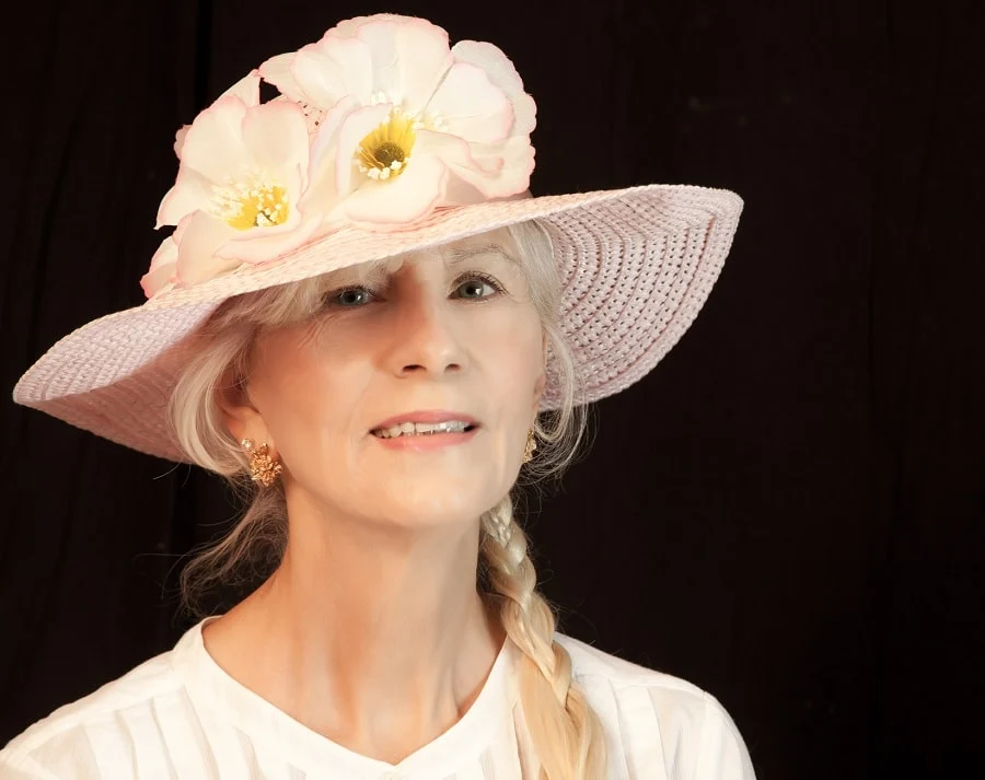 wedding guest hairstyle with hat for women over 50