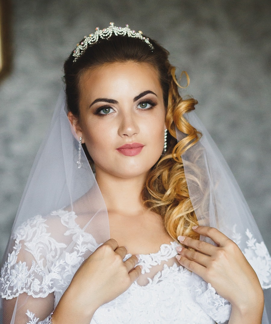 wedding hairstyle to the side with tiara and veil