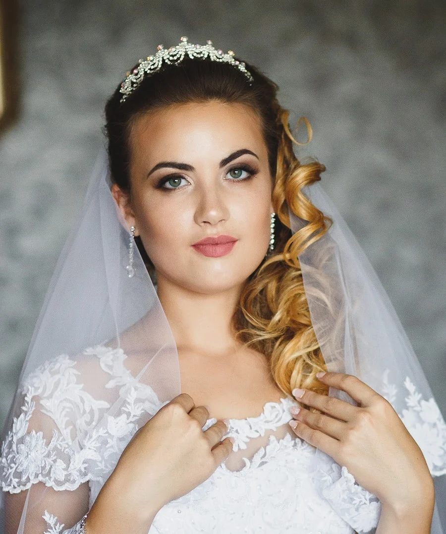 wedding hairstyle to the side with tiara and veil