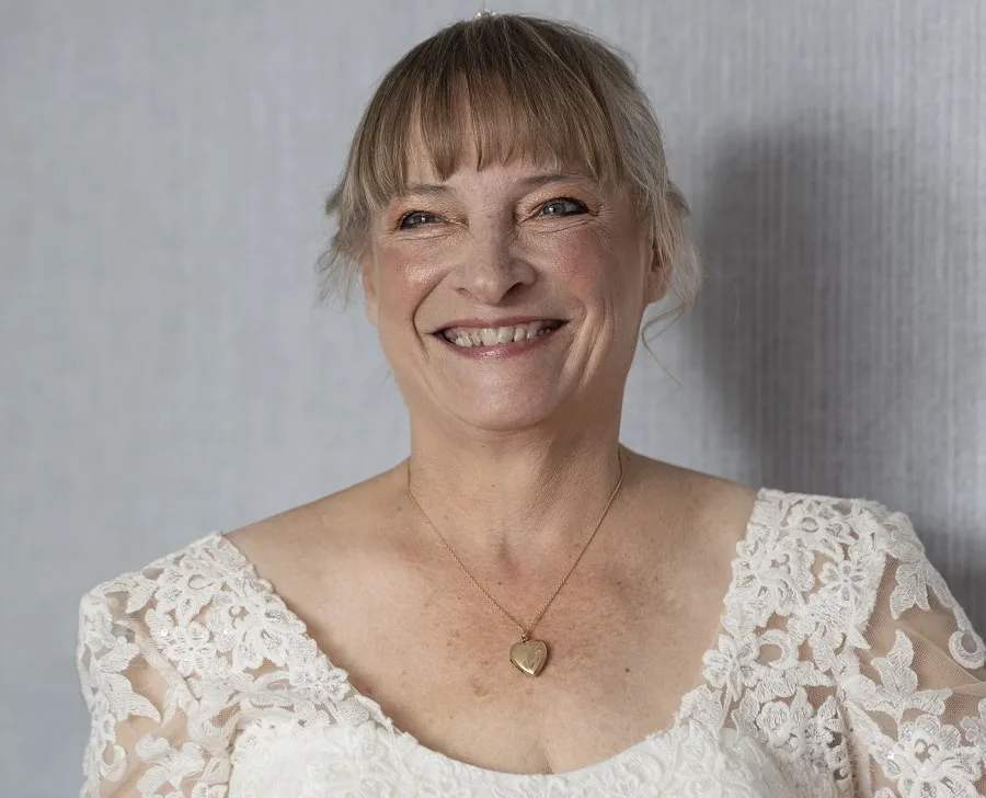 wedding hairstyle with bangs for bride over 50