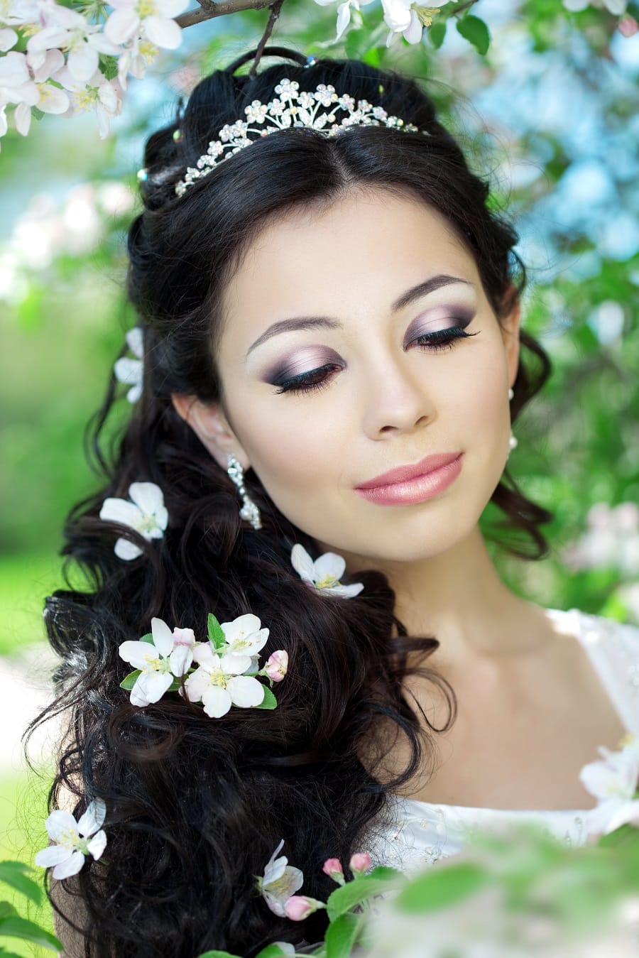 wedding hairstyle with flowers and tiara