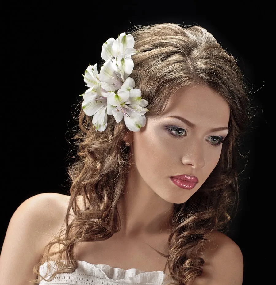 wedding hairstyle with flowers to the side
