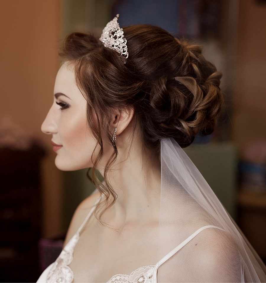 wedding hairstyle with tiara and veil underneath